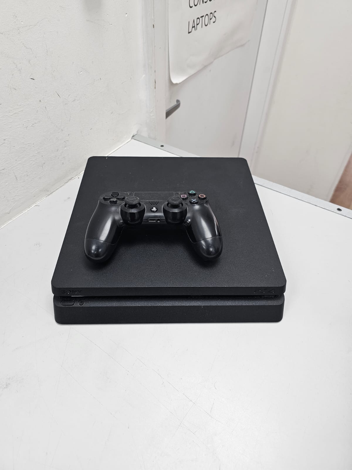 Product photo for Sony PlayStation 4 Slim 500GB Console - With Controller