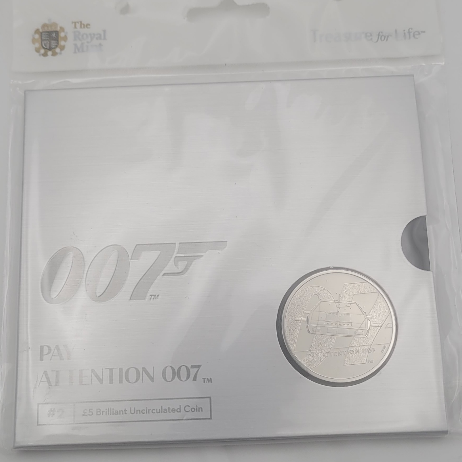 Product photo for 007 Pay Attention £5 Brilliant Uncirculated Coin