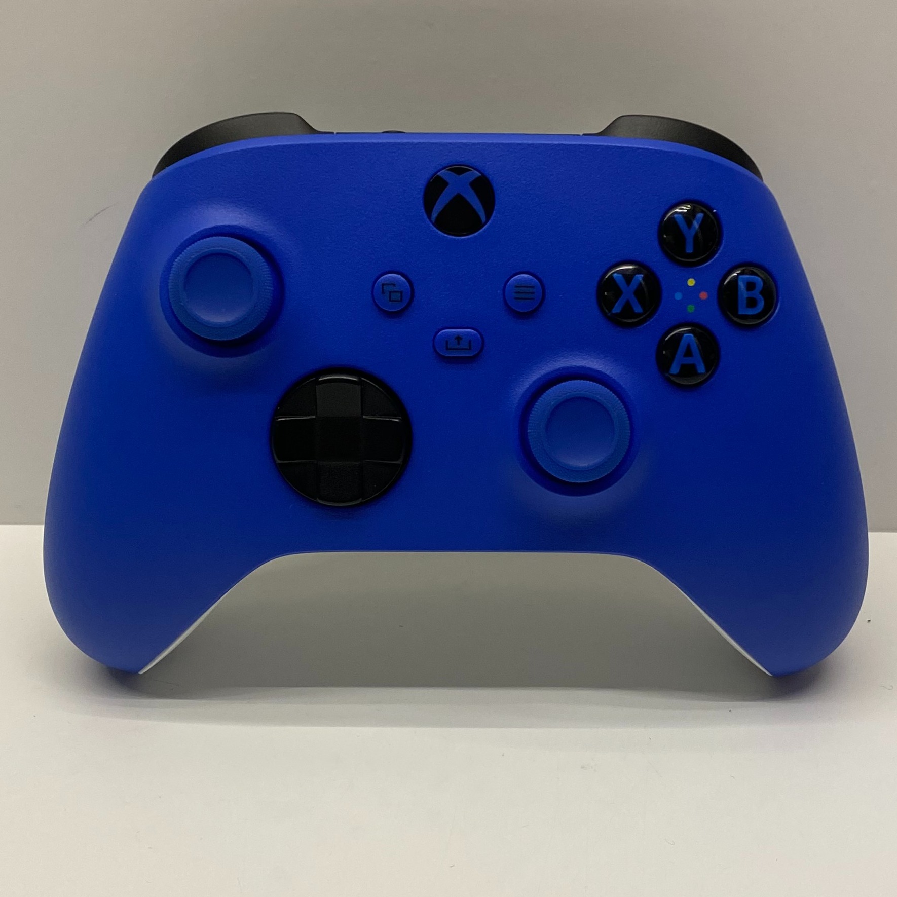 Product photo for Microsoft Xbox Wireless Controller in Shock Blue Boxed