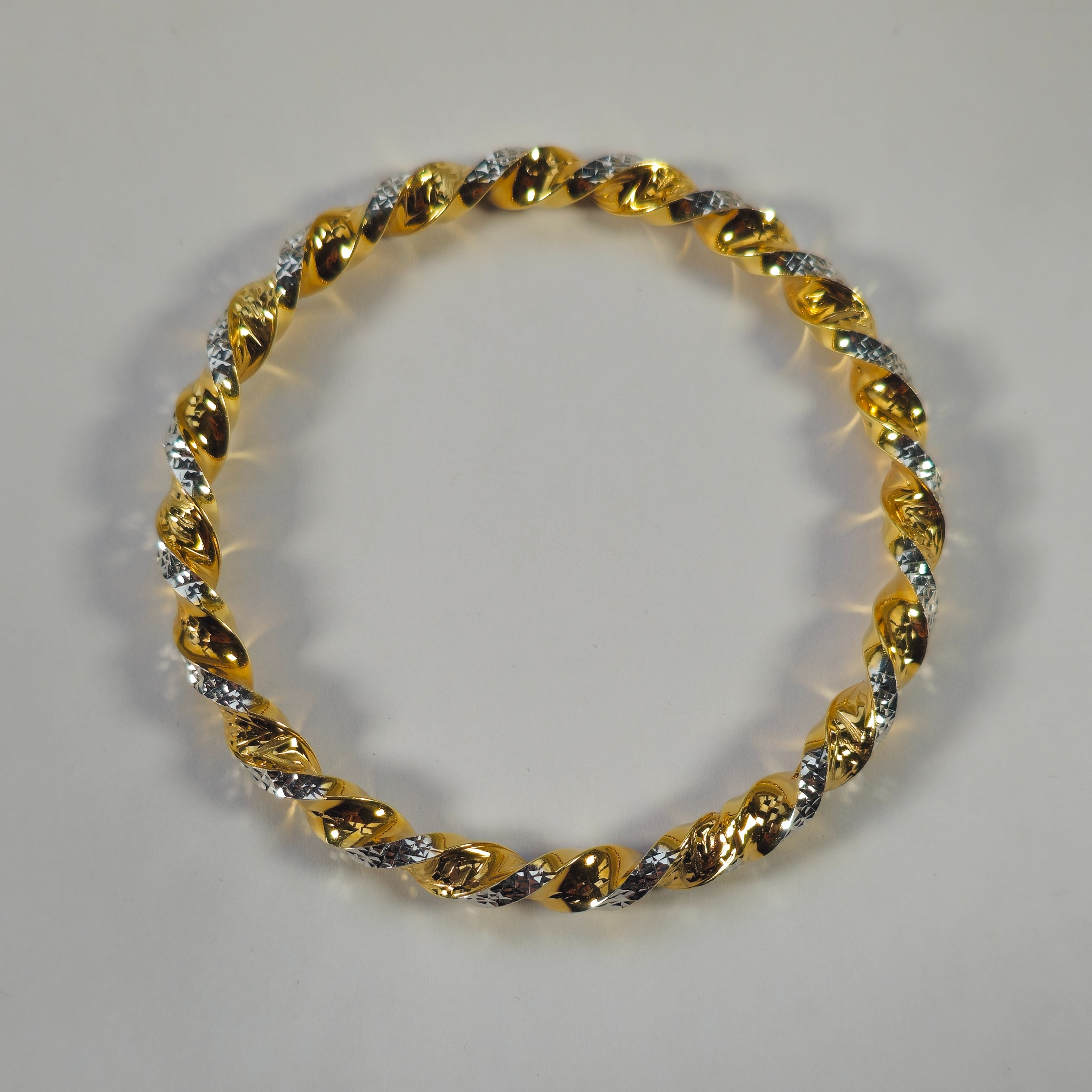 Product photo for 9ct Gold 2 Tone Ribbon Twisted Slip-On Bangle